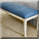 F58. Blue fabric bench with white painted legs. 20”h x 54”w  x 18”d 